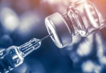 Vaccines Flashpoint Ignites Surgeon General Race syringe needle drawing liquid from a vaccine vial