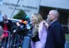 Press Conference Meltdown Raises Eyebrows Woman addressing a press conference with multiple microphones