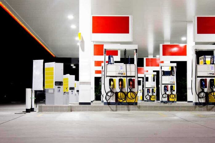 Gas station fuel pumps at night