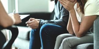 Couple sitting on couch during counseling session
