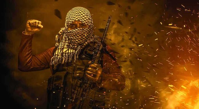 shutterstock_1401389099 masked person with rifle amid sparks