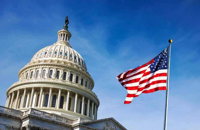 U.S. Capitol dome with American flag against blue sky