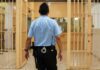 Child Killers Out – Canada Calls It Rehab corrections officer walking through prison corridor
