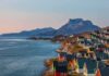 Permanent U.S. Foothold? Greenland Gate Slams on Russia, China Colorful coastal town with mountains and sea at sunset