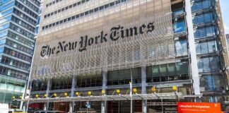 New York Times building with yellow taxis in front