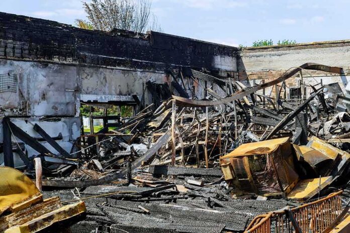 shutterstock_1751557622-1 Burned building interior with collapsed charred debris