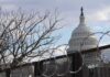 U.S. Capitol dome behind barbed security fence