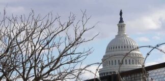 U.S. Capitol dome behind barbed security fence