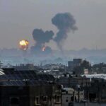 Zelenskyy’s Warning: Russia SHOWS No Mercy Cityscape with distant explosions and rising smoke