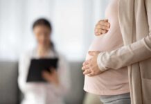 Prosecutors Probe ‘Baby Packages’ Pitch Pregnant woman holding belly during medical visit