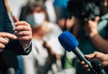 White House Blacklist – Media Offenders List Triggers Purge Microphones held toward a speaker at an outdoor press event