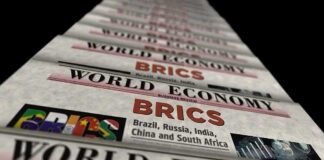 Stack of newspapers highlighting BRICS and world economy