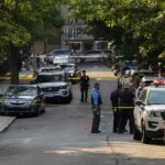 Sword Horror Jolts ‘Safe’ Sweden Police officers secure a residential street with patrol cars and yellow tape