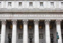 ICE Threat Plot Unmasked — 15 Indicted United States courthouse facade with Corinthian columns