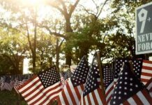 Mayor’s Baffling Pen Gift Ignites Backlash American flags displayed outdoors at a memorial