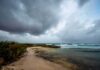 Storm clouds over a rocky beach shoreline