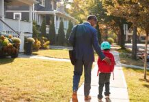 Virginia Judge Criminalizes Normal Parenting Man walking with child on sidewalk