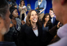 Harris Torches Trump – Tyrant Charge Lights Fuse Kamala Harris smiling among supporters with Maya Harris nearby