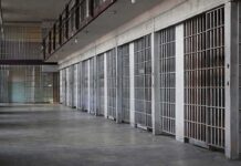 Cellmate Strangled Only 8 Days From Release prison cell block with metal barred doors