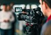 Media Frenzy Buries $15B Jobs Score Video camera filming a group of people
