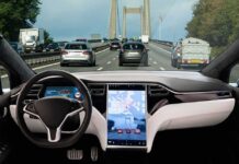 Human Driver Mandate Nukes Robotaxis – Ban-In-Disguise? Self-driving car interior on a busy bridge highway