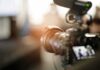 Video camera with external microphone recording indoors