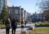 students walking on a university campus pathway