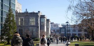 students walking on a university campus pathway