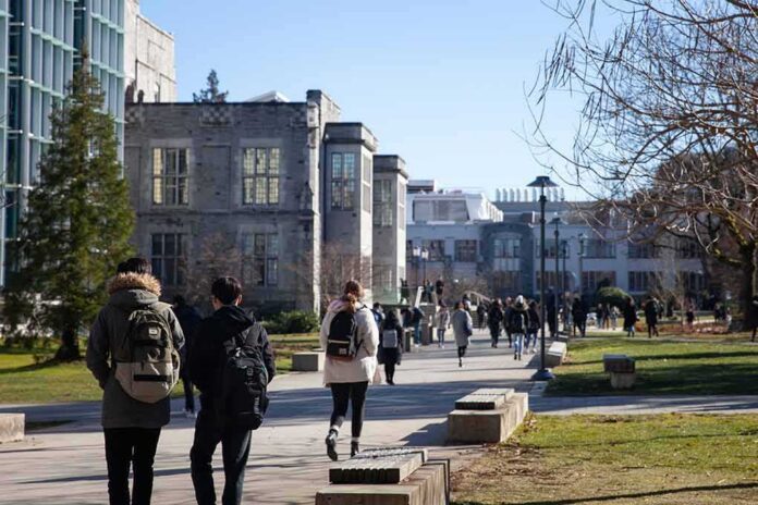 students walking on a university campus pathway