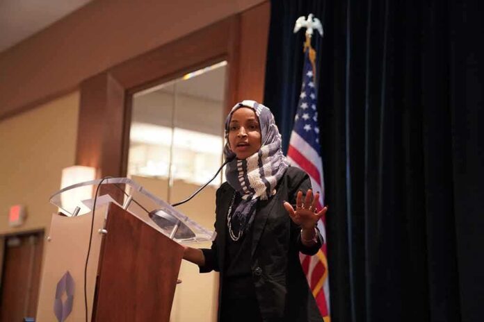 Ilhan Omar speaking at a podium with a microphone