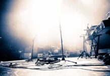 Health Scare Freezes Billy Joel Tour Empty concert stage with instruments and bright lights