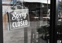 NY Court Slaps Faith-Based Bridal Refusal Closed sign hanging on a glass door