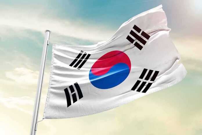 shutterstock_1723792165 South Korea flag waving on a pole