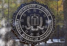 FBI Firings Explode – Political Purge Alleged FBI seal on a building wall