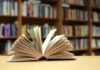 Open book on a table in a library