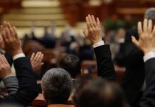 Raised hands in a formal meeting or vote