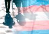 Tax Dollars Fund Youth Hormones – Despite Bans trans pride flag overlaying silhouettes of people walking on a city street