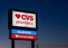 Taxpayer Scam? CVS Hit With Massive Bill CVS pharmacy sign at dusk