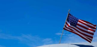 American flag on U.S. Air Force aircraft against blue sky