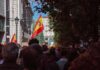 Spain’s Pushbacks Trigger EU Legal Clash Crowd with Spanish flags in a city street