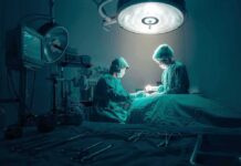 American Surgeons Rewire War-Torn Eyes Surgeons perform an operation under bright surgical light