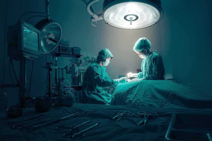 Surgeons perform an operation under bright surgical light