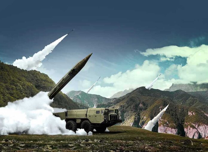 shutterstock_708926692 mobile missile launcher firing in mountain landscape